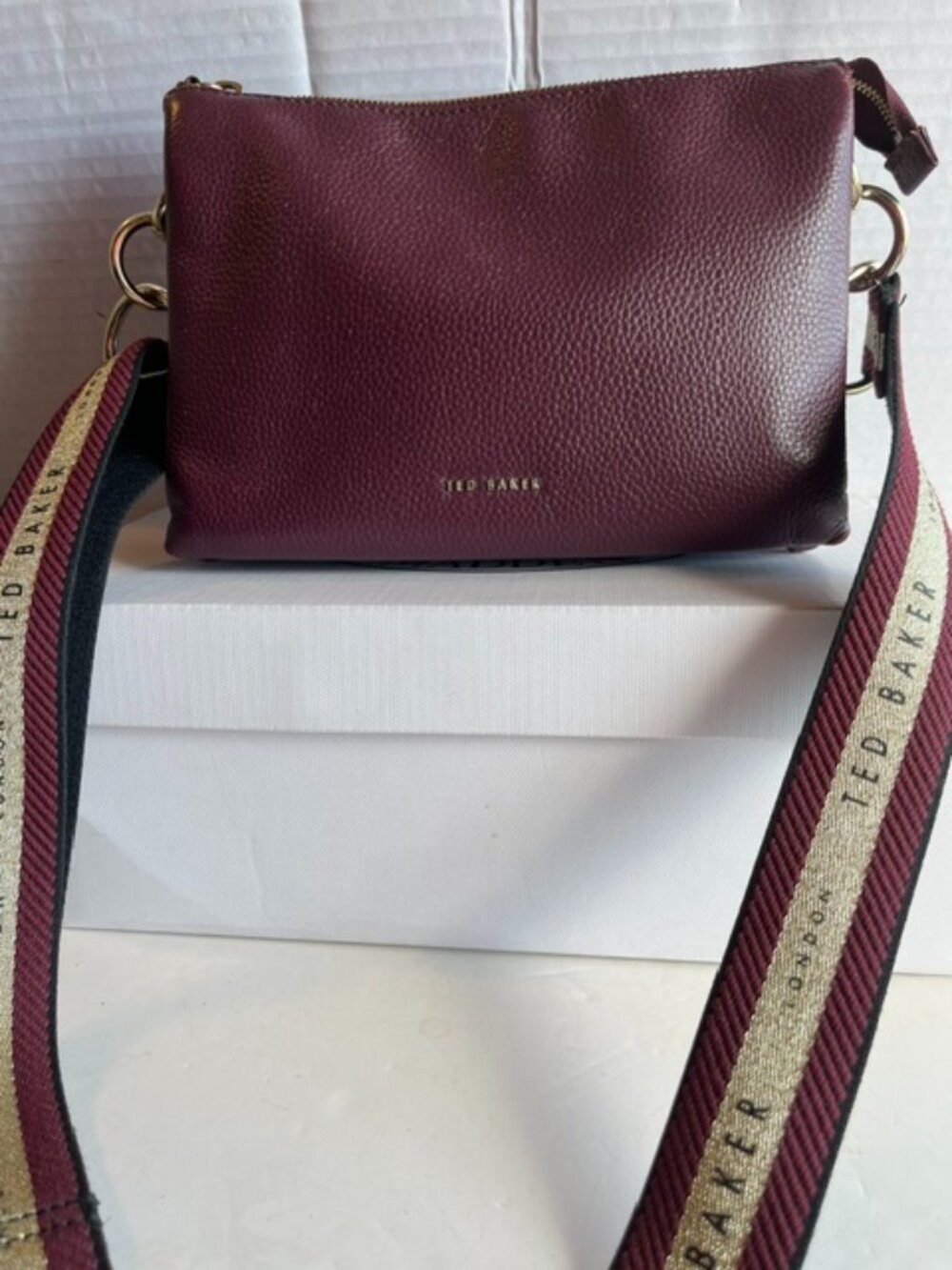 Ted Baker London wine leather crossbody bag.